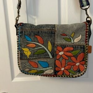 Patricia Nash floral embroidered denim purse.